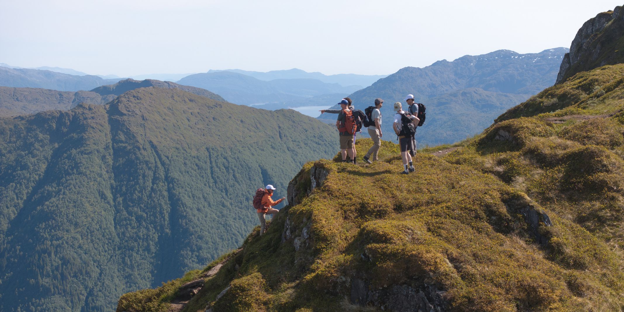 Hikers-on-the-822m-peak-of-Bruviknipa-in-Osteroy-near-Bergen