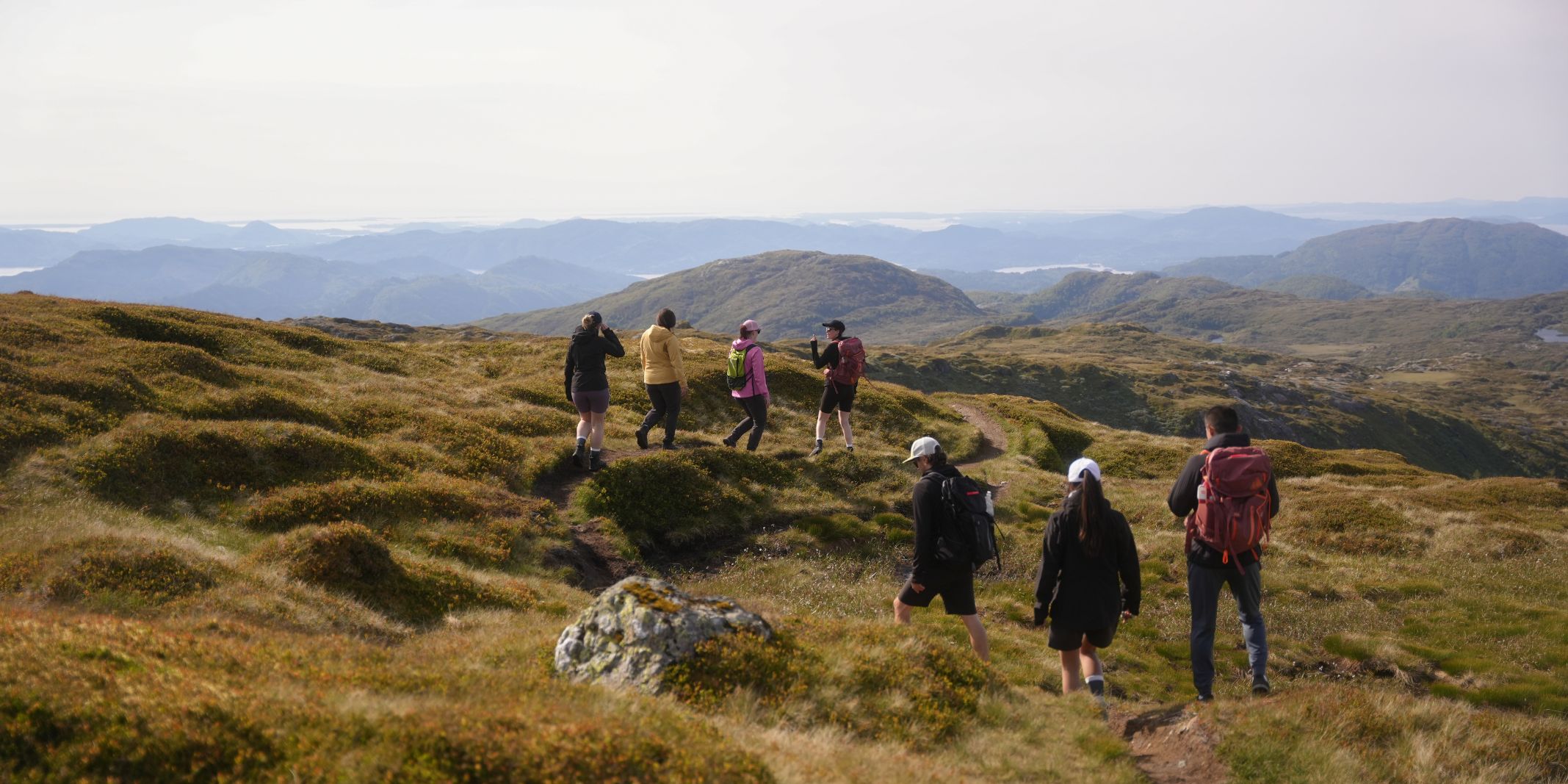 Hikers-on-the-822m-peak-of-Bruviknipa-in-Osteroy-near-Bergen