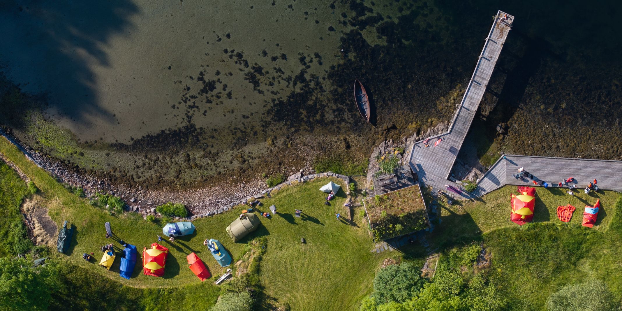 Drone-shot-camping-alongside-the-fjord-in-Osteroy-near-Bergen-Norway