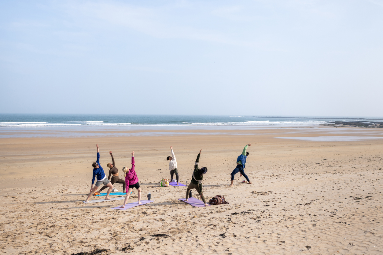 group-beach-yoga