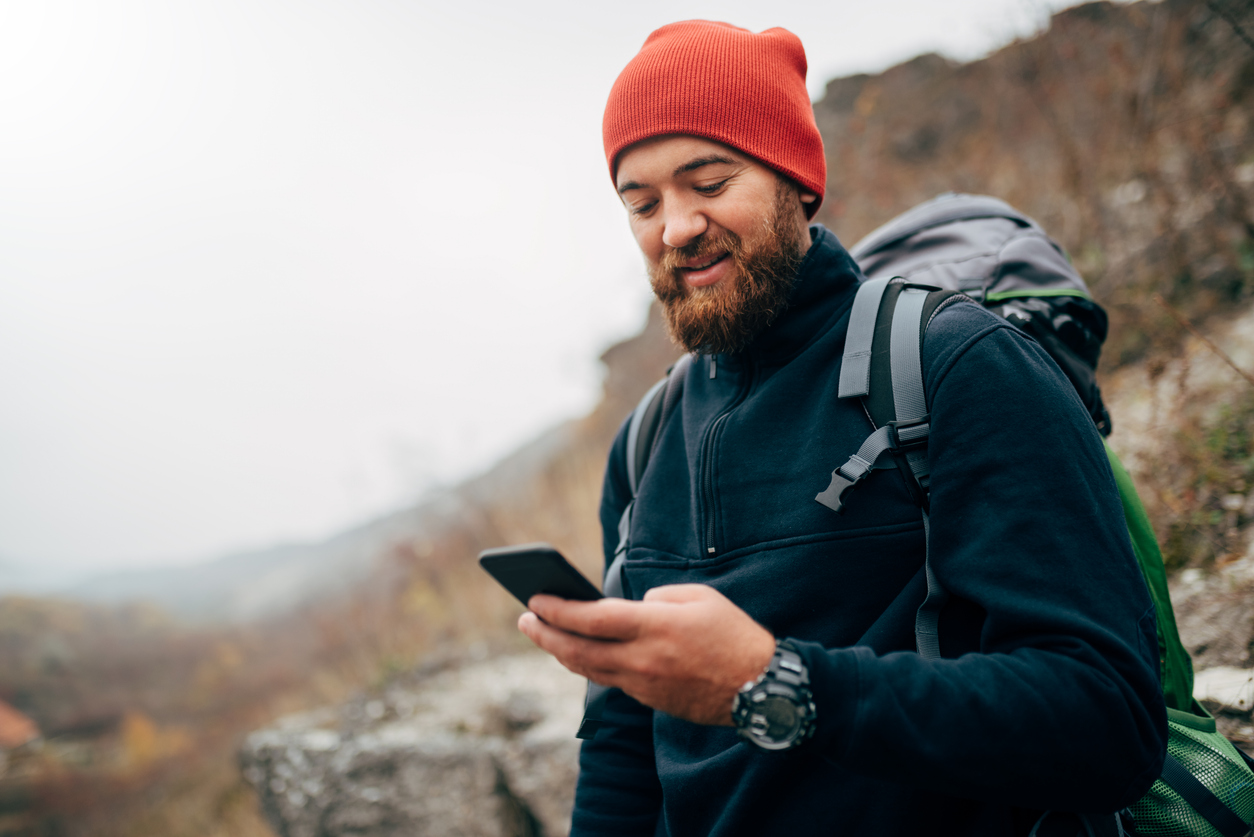 hiker-with-smartphone-in-hand