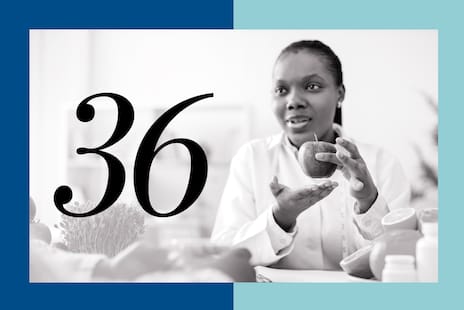 A doctor holding up an apple with the number "36" to her left.