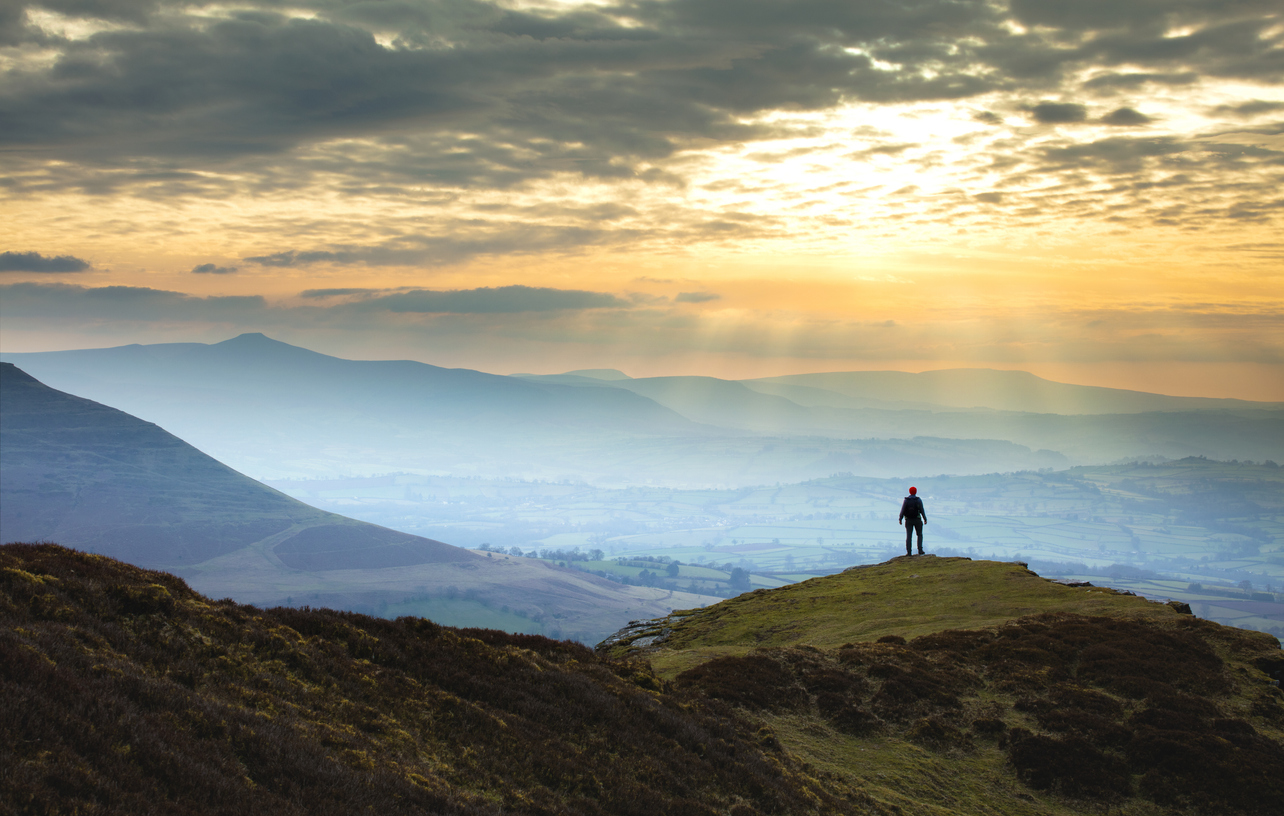 person-on-top-of-mountain-in-wales-sunset-hike