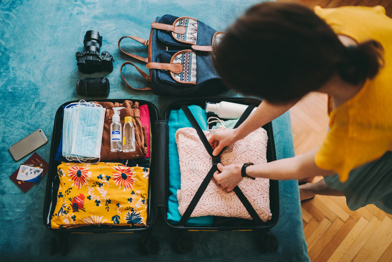 woman-packing-travel-bag